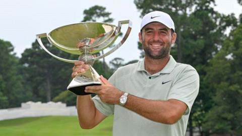 Scottie Scheffler with the Tour Championship trophy in 2024