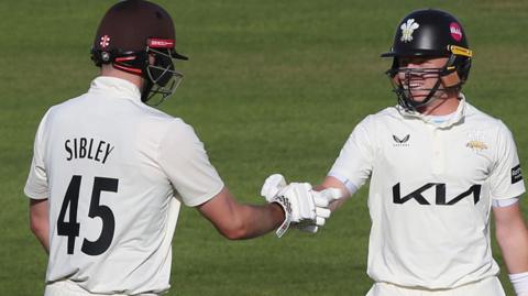 Dom Sibley and Ollie Pope bump fists