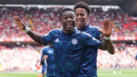 Abdul Fatawu celebrates with arms aloft after scoring for Leicester City