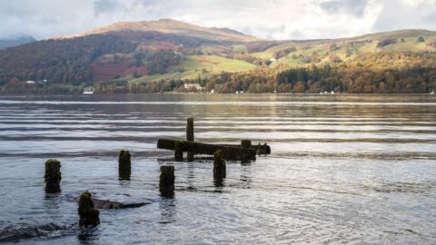 A partially sunk jetty on the banks of Lake Windermere