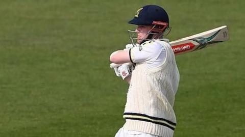 Dan Mousley pulls the ball batting for Warwickshire