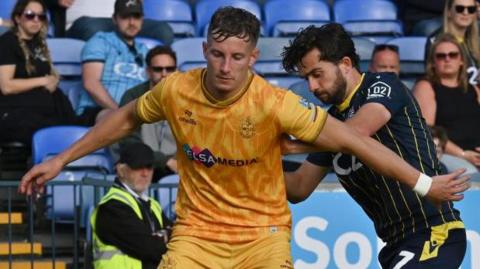 Fleetwood Town striker Will Davies in action for Sutton United against Southend United 