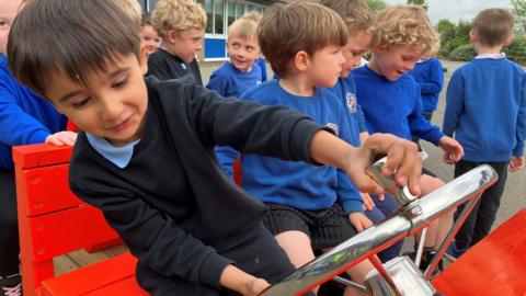 Child using steering wheel 