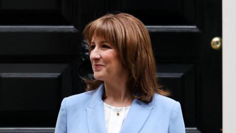 Rachel Reeves pictured outside No 11 Downing Street, wearing a light blue suit