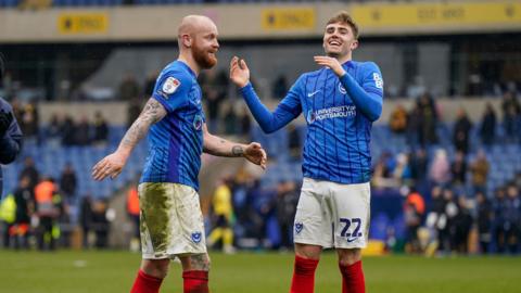 Connor Ogilvie (left) and Zak Swanson (right) celebrate after playing against Oxford United