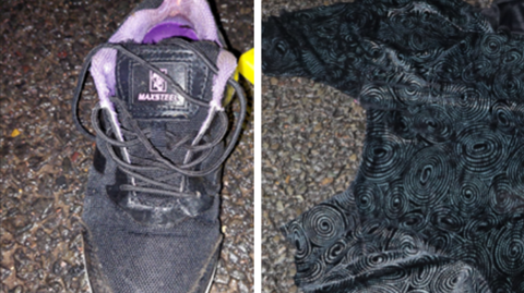 On the left is a pink and navy blue trainer. On the right is the dark blue hooded zip-up top. Both are placed on the ground.