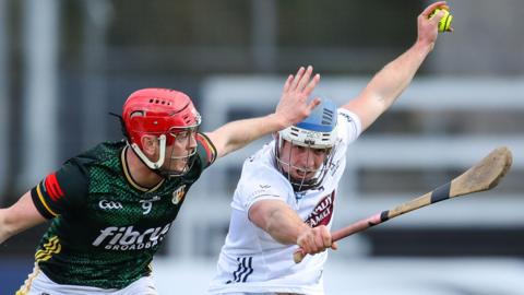 Kildare's Dan O'Meara keeps the ball away from Eoin O'Neill