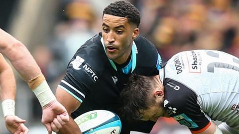 Keelan Giles of Ospreys is tackled by Steff Hughes of Dragons