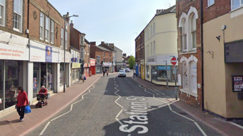 Station street has an array of shops and premises on either side of the road.