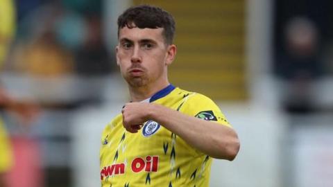 Midfielder Ryan East in action for Rochdale