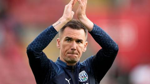 Albion club captain Jed Wallace applauds the Baggies fans. 