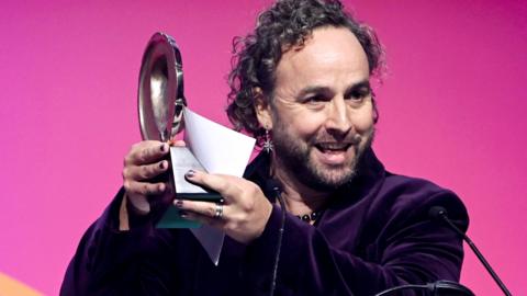 Daf James accepts the Writer Award for 'Lost Boys and Fairies' during the 2025 BAFTA Cymru Awards 