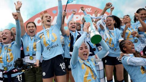 Manchester City players with the Women's Super League trophy