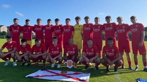 Jersey's men's team pose for a photo