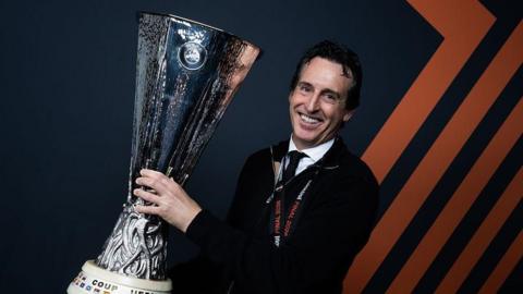 Unai Emery holds Europa League trophy