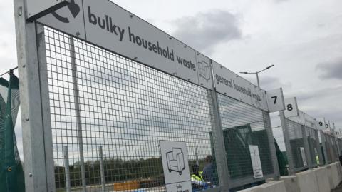 Thorn Turn Household Recyling Centre, showing a sign for scrap metal, netting, and barriers.