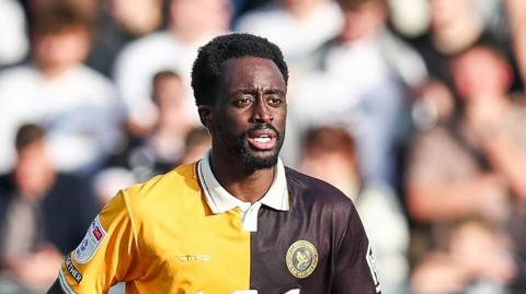Fabio Tavares playing for Burton Albion on a sunny afternoon