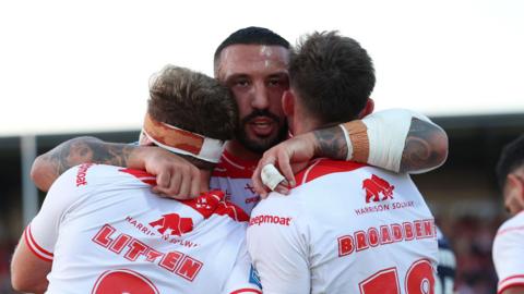 Hull Kingston Rovers' Jack Broadbent celebrates scoring a try with Jez Litten and Elliot Minchella