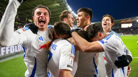 Dan James is mobbed as Leeds celebrate a goal