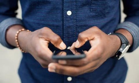 A man using a smartphone.