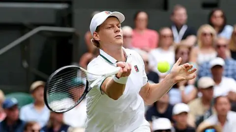 Jannik Sinner hits a forehand shot