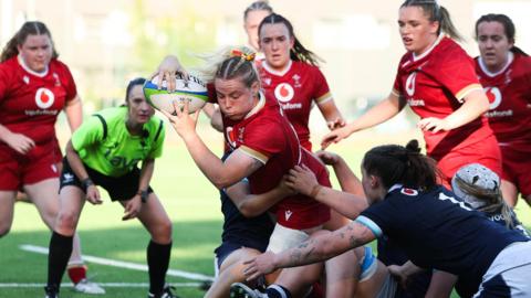 Savannah Picton-Powell powers over for one of her two tries for Wales