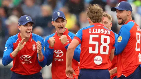 England players celebrate a wicket