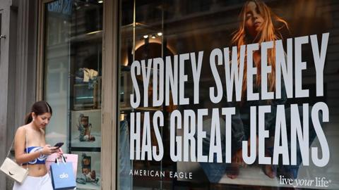 Street advertisement that reads "Sydney Sweeney Has Great Jeans"