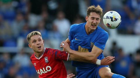 George Hirst of Ipswich Town and Phil Neumann of Birmingham City in action