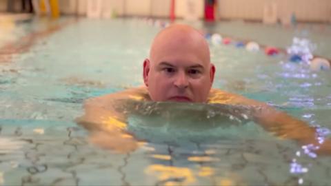 BBC Radio Leeds commentator James Deighton, swimming in a pool.