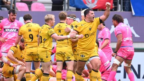 Dragons prop Chris Coleman celebrates a try