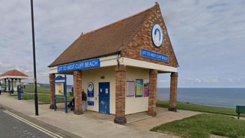 A small brick building which houses a cliff lift on the Whitby sea front.