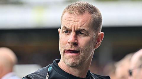 Harrogate manager Simon Weaver watches from the touchline