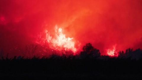 Wildfires engulf the landscape in southern France