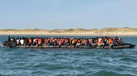 A large inflatable boat carrying 230 people in the Channel