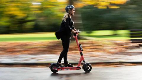 Woman on e-scooter