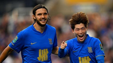 Kyogo Furuhashi of Birmingham City celebrates scoring his team's first goal with teammate Willum Willumsson