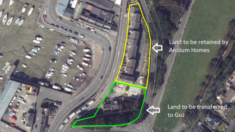 An aerial photo of the Haut du Mont site. The north part of the site is outlined with yellow and an arrow points to it labelled: Land to be retained by Andium Homes. The area to the south of this one is outlined in green with an arrow pointing to it labelled: Land to be transferred to GoJ.
To the left of the site is a harbour with about 20 small boats moored up. To the right of the site is a green field. 