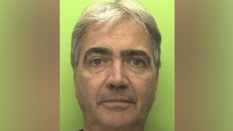 A custody image of Franchi