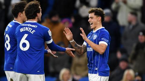 Alex Robertson (right) celebrates scoring for Cardiff 