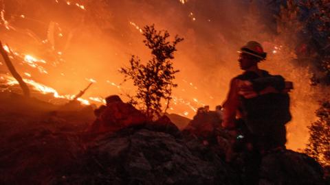  A firefighter battles a fire