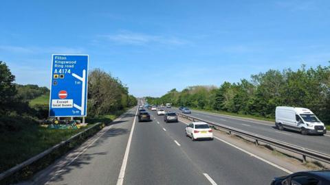 An image of the M32 motorway with a sign showing the junction to Filton, Kingswood and the ring road.