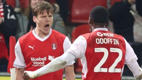 Sean Raggett screams in celebration after scoring the winner for Rotherham against former club Lincoln