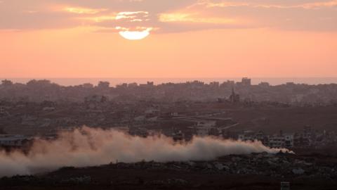 Smoke rises from Gaza as the sun sets, as seen from the Israeli side of the Israel-Gaza border