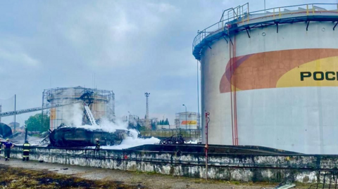 A photo posted by Sochi Mayor Andrei Proshunin purportedly showing firefigthers still working after extinguishing a blaze at an oil depot near Sochi. 