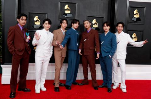 BTS pose on the red carpet as they attend the 64th Annual Grammy Awards at the MGM Grand Garden Arena in Las Vegas, Nevada.