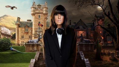 Claudio Winkleman stood in front of a castle. On her left the castle is set in a bright, sunny background with a peacock and train seen. On her right, the castle is in darkness with an orange glow coming from a fire torch.