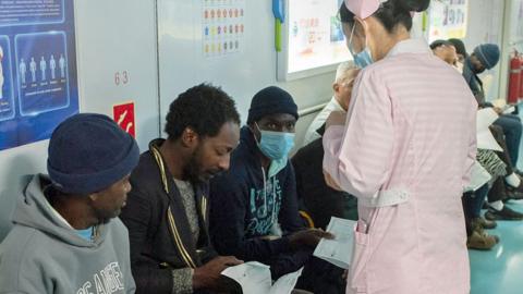 A member of the Chinese military medical team assessing patients on board the Peace Ark in Cape Town, South Africa - 26 August 2024