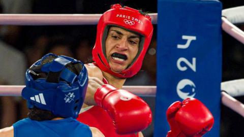 Imane Khelif delivers a right hook to China's Liu Yang in the final of the welterweight boxing event at Paris 2024