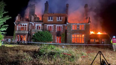 Fire engulfs large former care home in Liss .  It is a sprawling grand building over three floors.